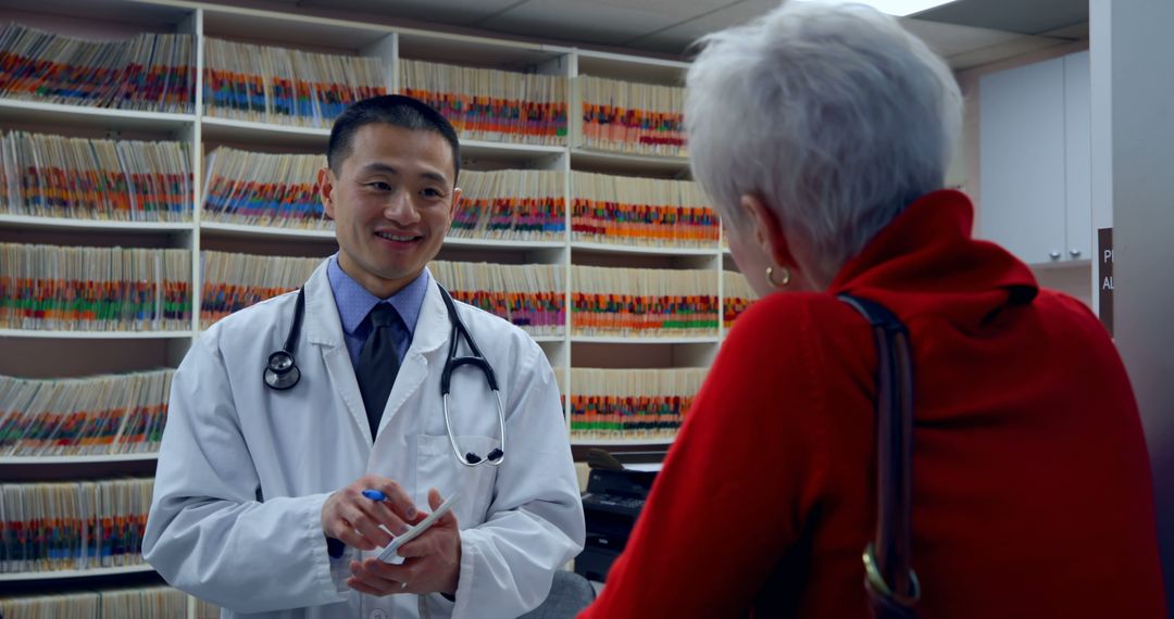 Doctor Consulting with Senior Patient at Modern Clinic - Free Images, Stock Photos and Pictures on Pikwizard.com