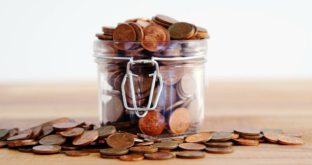 Glass Jar Filled with Coins for Savings and Financial Planning - Free Images, Stock Photos and Pictures on Pikwizard.com