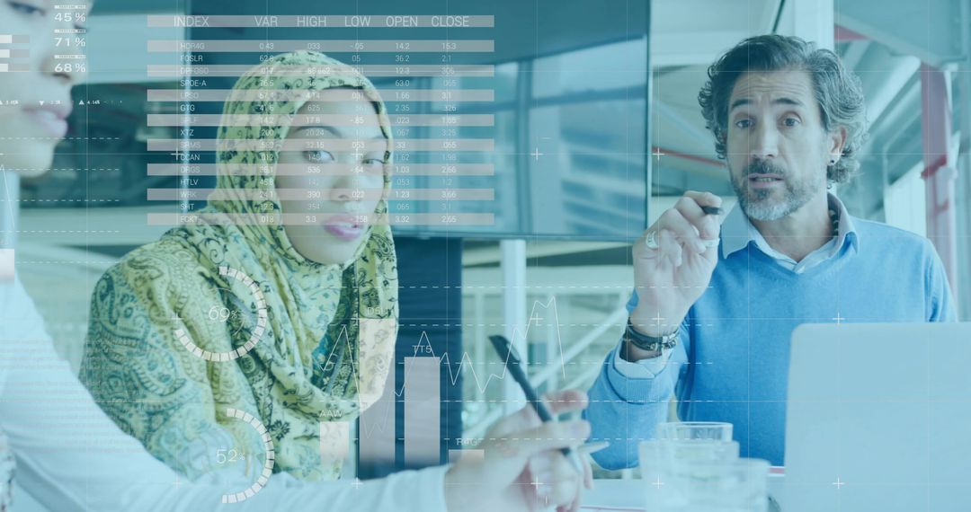 Collaborating and Analyzing Business Data in Glass Boardroom with Woman in Green Hijab