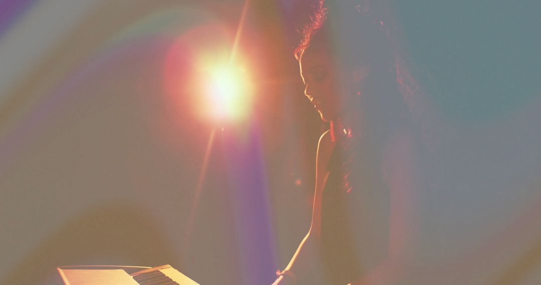 Woman Musican Playing Electronic Keyboard With Lens Flare