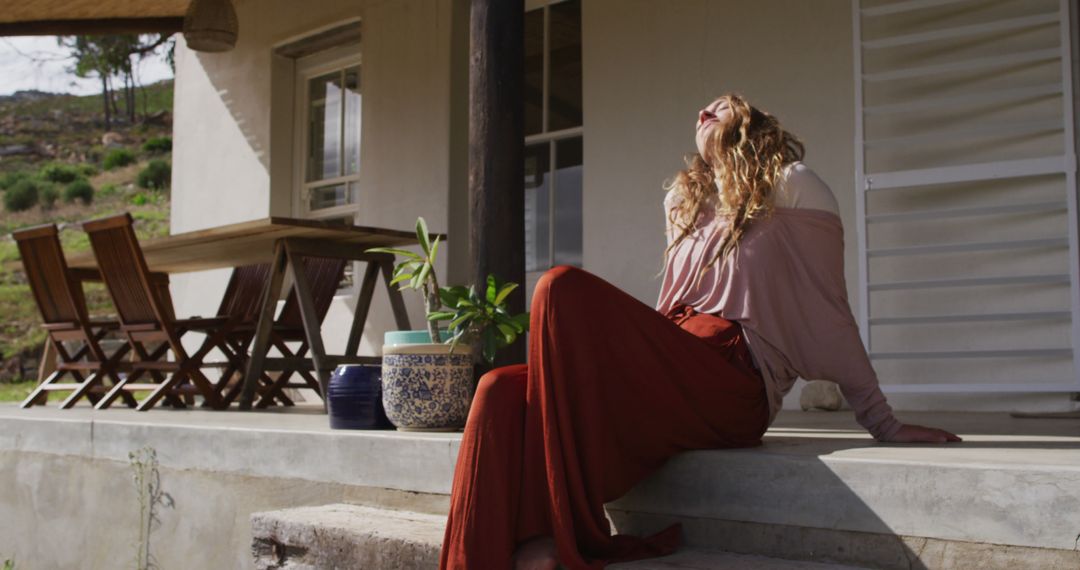 Woman Relaxing on Porch Outside Cozy Home - Free Images, Stock Photos and Pictures on Pikwizard.com