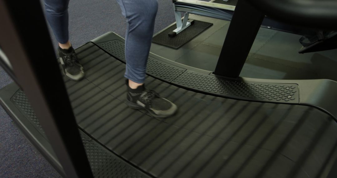 Person Running on Curved Treadmill in Gym - Free Images, Stock Photos and Pictures on Pikwizard.com