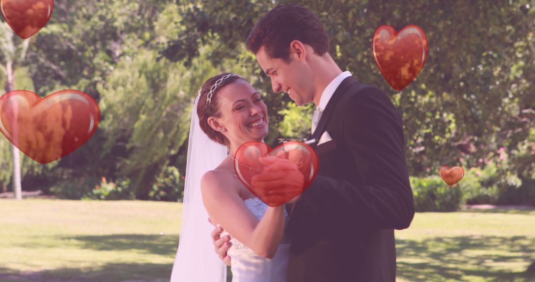 Bride and Groom Embracing Outdoors with Heart Graphics - Free Images, Stock Photos and Pictures on Pikwizard.com