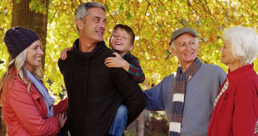 Multi-generational Family Enjoying Autumn Day Outdoors - Free Images, Stock Photos and Pictures on Pikwizard.com