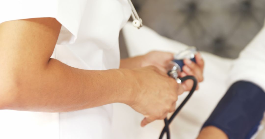 Nurse Measuring Blood Pressure with Sphygmomanometer - Free Images, Stock Photos and Pictures on Pikwizard.com