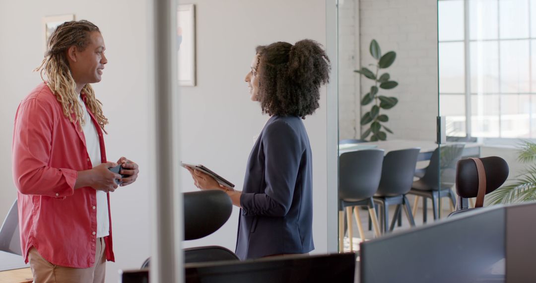 Diverse Colleagues Engaging in Productive Office Discussion