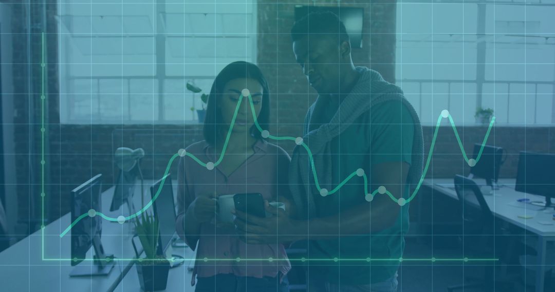 Colleagues Analyzing Data with Overlayed Graph in Modern Office