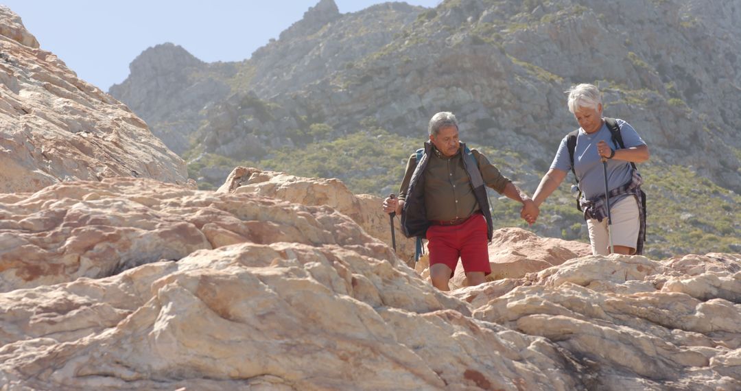 Senior Couple Hiking in Rocky Mountain Terrain - Free Images, Stock Photos and Pictures on Pikwizard.com