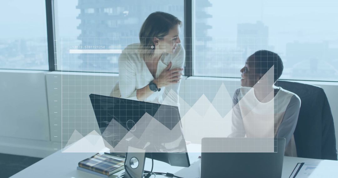 Diverse Colleagues Discussing Financial Data in Modern Office