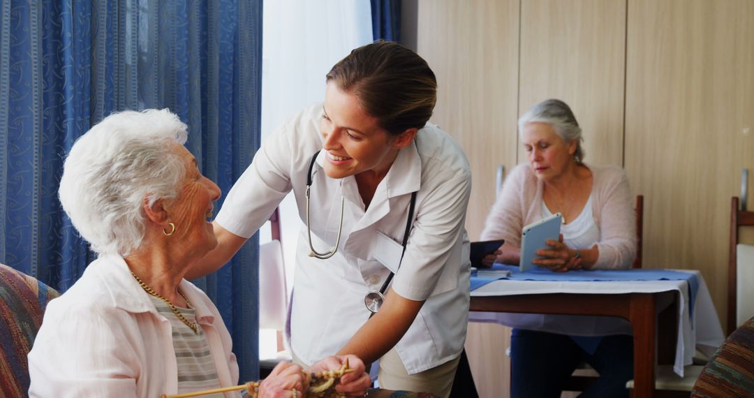 Smiling Nurse Assisting Elderly Woman in Nursing Home - Free Images, Stock Photos and Pictures on Pikwizard.com