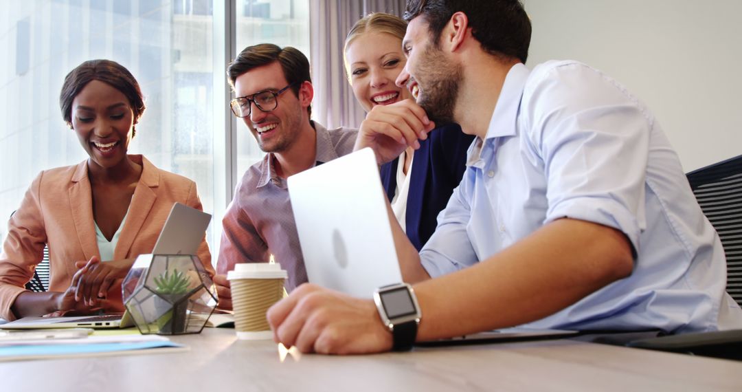Friendly Business Team Discussing Ideas in Office Meeting