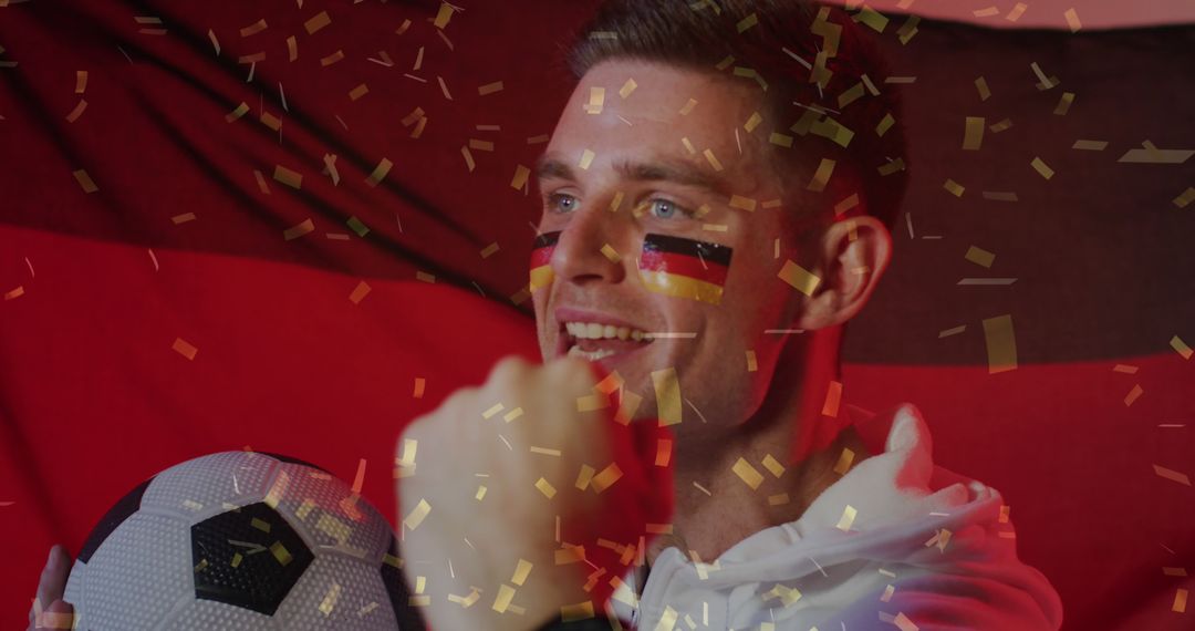 Excited German Soccer Fan Celebrating Victory with Flag and Confetti - Free Images, Stock Photos and Pictures on Pikwizard.com