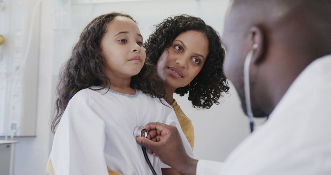 Doctor Examining Child Using Stethoscope with Concerned Parent Nearby - Free Images, Stock Photos and Pictures on Pikwizard.com