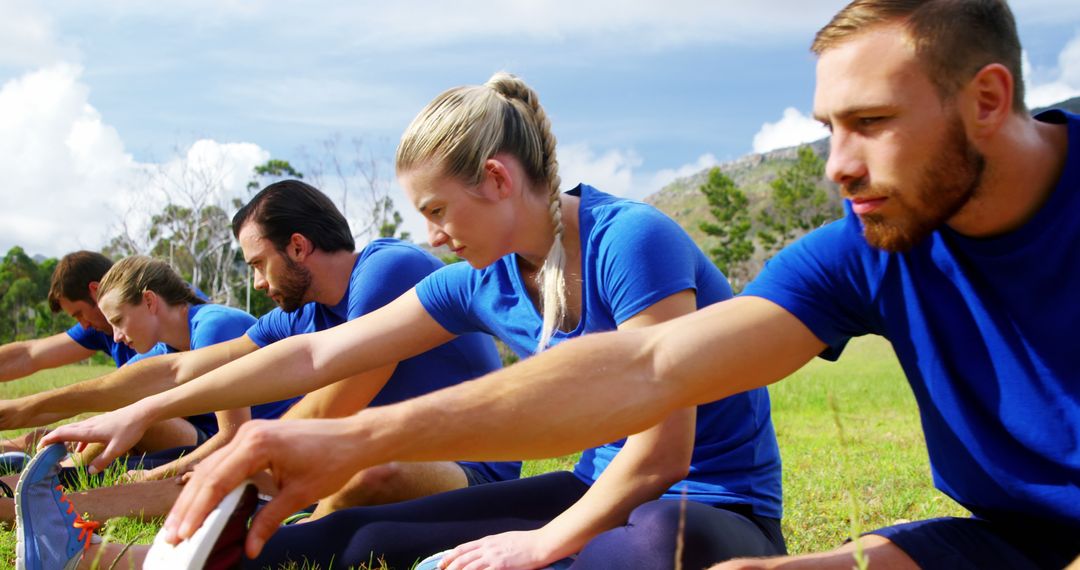 Group of Adults Stretching Outdoors in Field - Free Images, Stock Photos and Pictures on Pikwizard.com