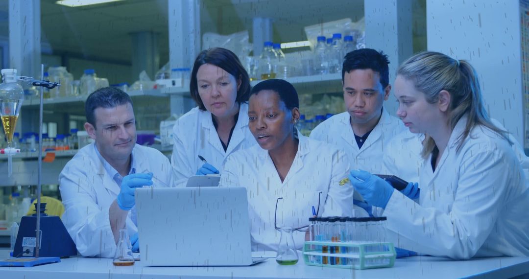 Diverse Team of Scientists Analyzing Data in Modern Research Lab