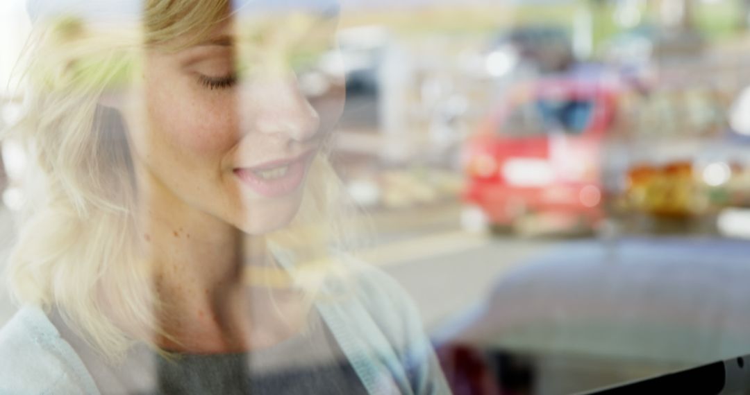 Woman Reflecting Near Window With City Street View - Free Images, Stock Photos and Pictures on Pikwizard.com