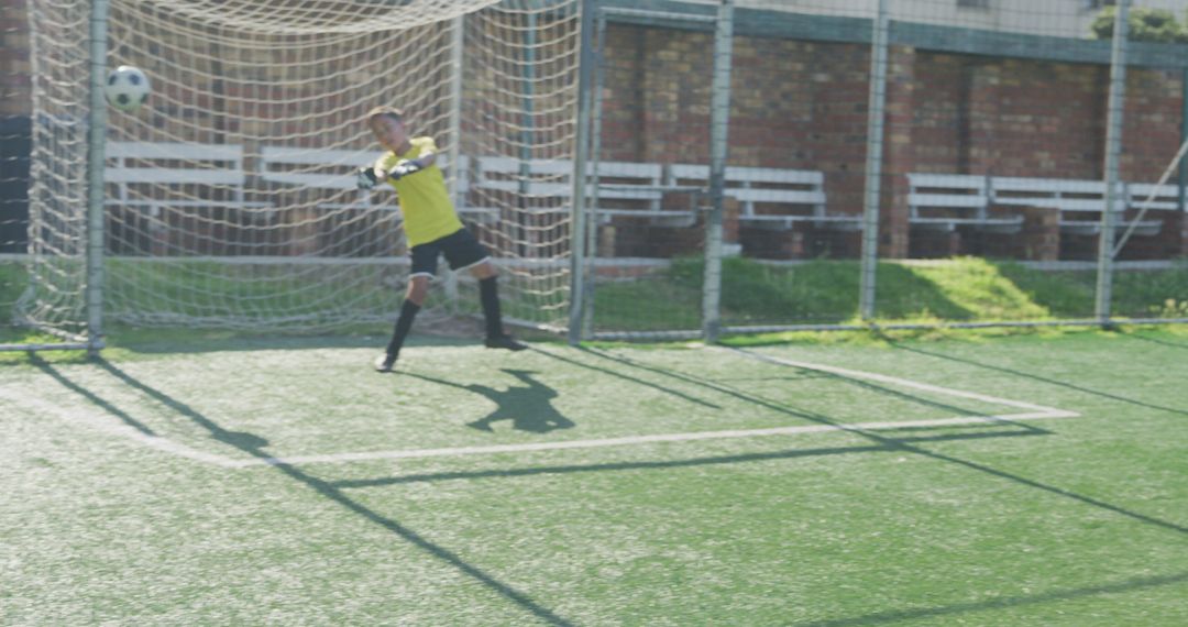 Youth Soccer Goalie Making a Save on the Field - Free Images, Stock Photos and Pictures on Pikwizard.com