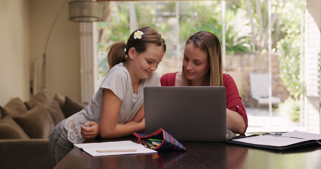 Mother and Daughter Working Together on Laptop at Home - Free Images, Stock Photos and Pictures on Pikwizard.com