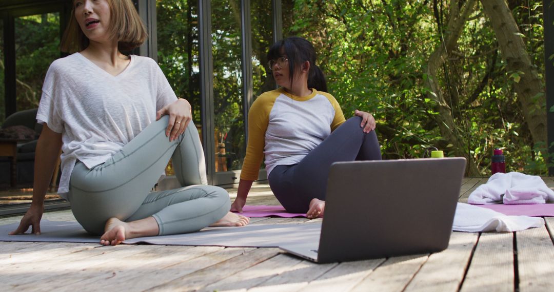 Women Practicing Yoga Outdoors with Virtual Class on Laptop - Free Images, Stock Photos and Pictures on Pikwizard.com