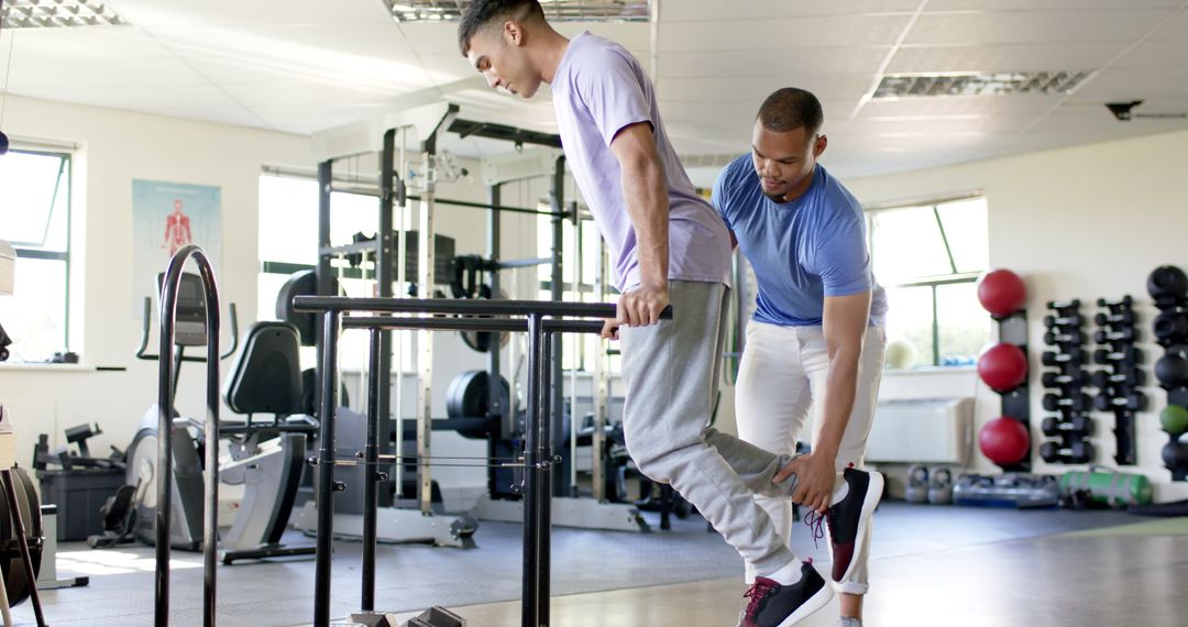 Rehabilitation Therapist Assisting Patient with Leg Exercises