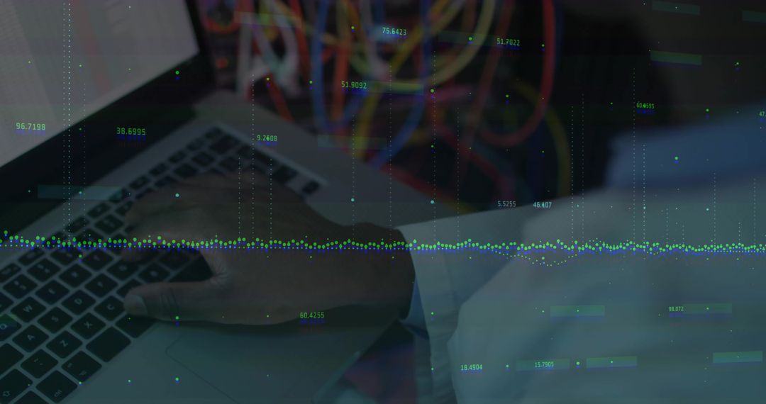 Engineer Typing on Laptop in Server Room with Data Overlay