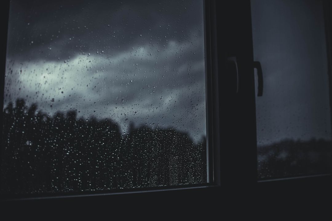 Rainy View through Window at Night