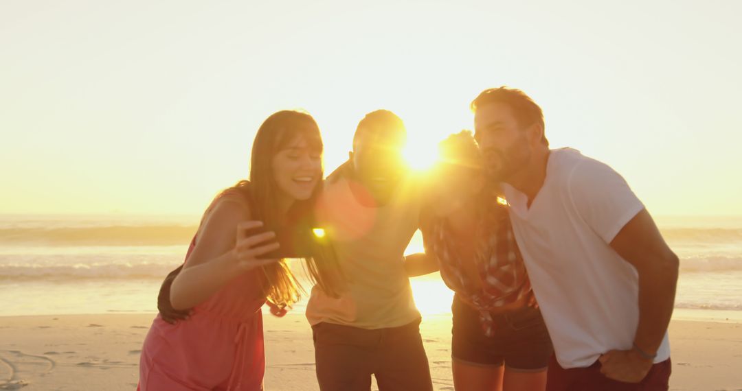 Group of Friends Taking Selfie at Beach During Sunset - Free Images, Stock Photos and Pictures on Pikwizard.com