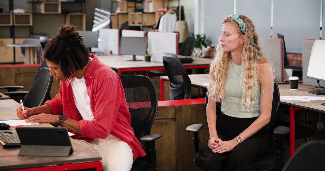 Office Colleagues Collaborating in Modern Workspace