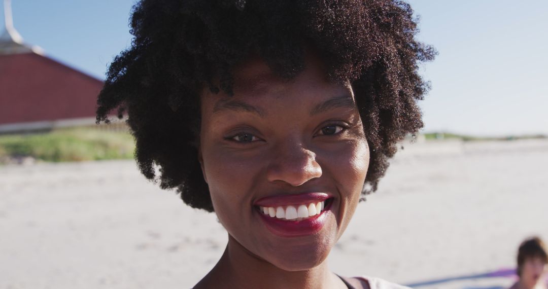 Smiling African American Woman at Sunny Beach - Free Images, Stock Photos and Pictures on Pikwizard.com