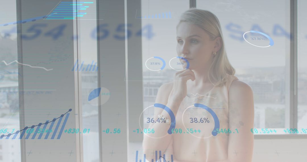 Woman Analyzing Financial Charts in Modern Office Environment - Free Images, Stock Photos and Pictures on Pikwizard.com