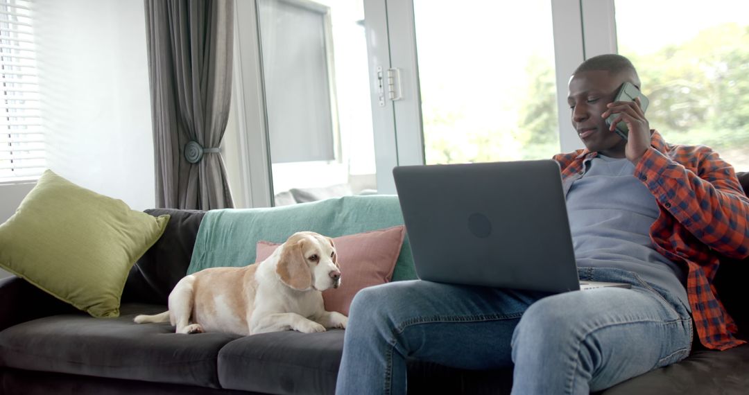 Man Working from Home with His Dog - Free Images, Stock Photos and Pictures on Pikwizard.com