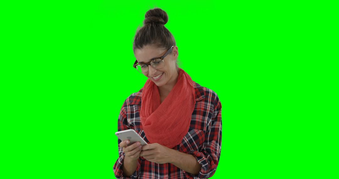 Smiling Woman Using Smartphone Against Green Screen - Free Images, Stock Photos and Pictures on Pikwizard.com