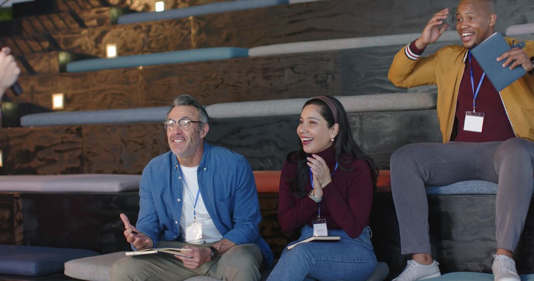 Clapping and Taking Notes during Workshop on Tiered Seating, Multicultural Team Engagement