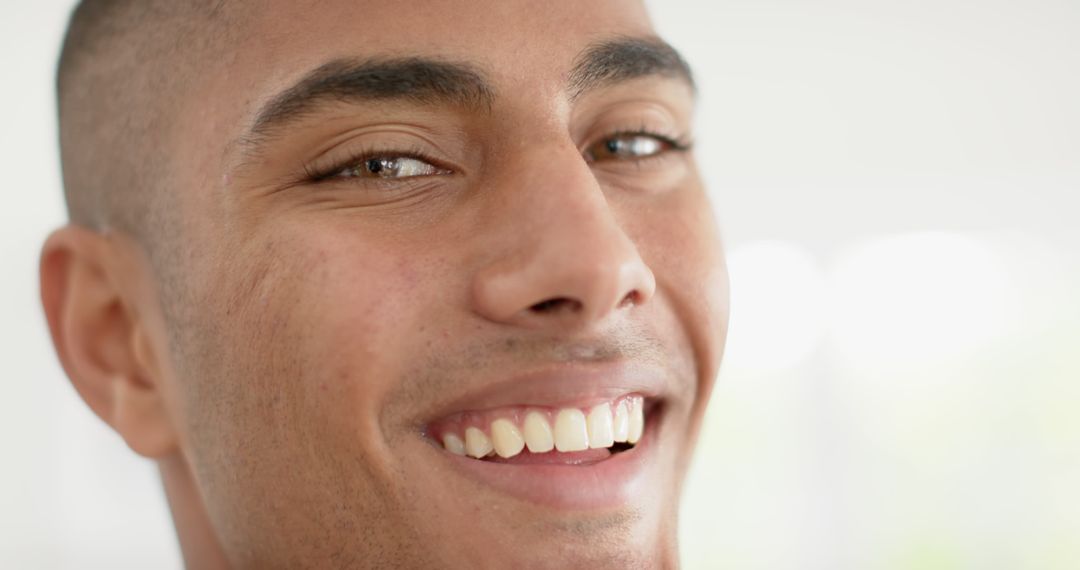 Smiling biracial man face close up with copy space - Free Images, Stock Photos and Pictures on Pikwizard.com