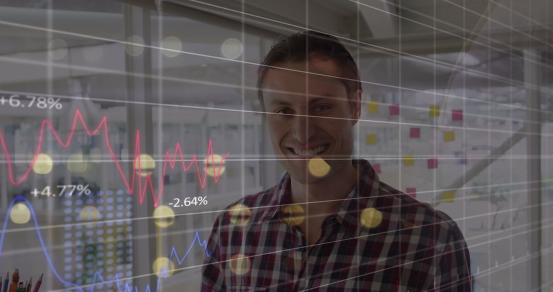 Smiling Man with Financial Data Overlay in Modern Office