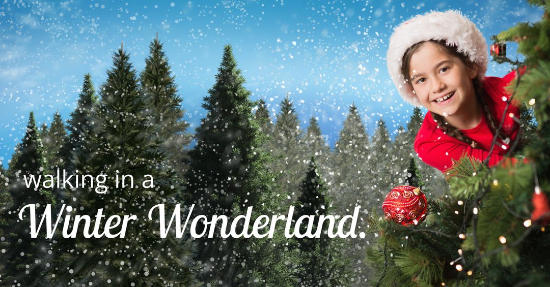 Joyful Child Decorating Christmas Tree in Snowy Wonderland