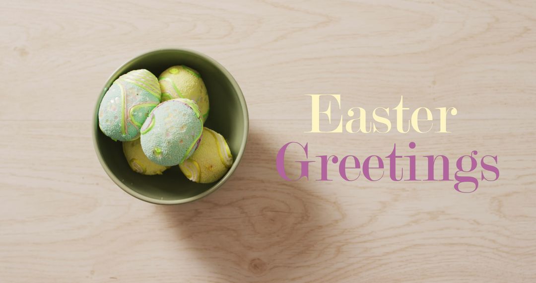 Colorful Easter Eggs in Bowl with Easter Greetings Text