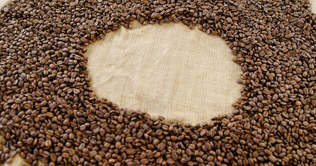 Brown Coffee Beans Arranged in Circular Pattern on Burlap Sack - Free Images, Stock Photos and Pictures on Pikwizard.com