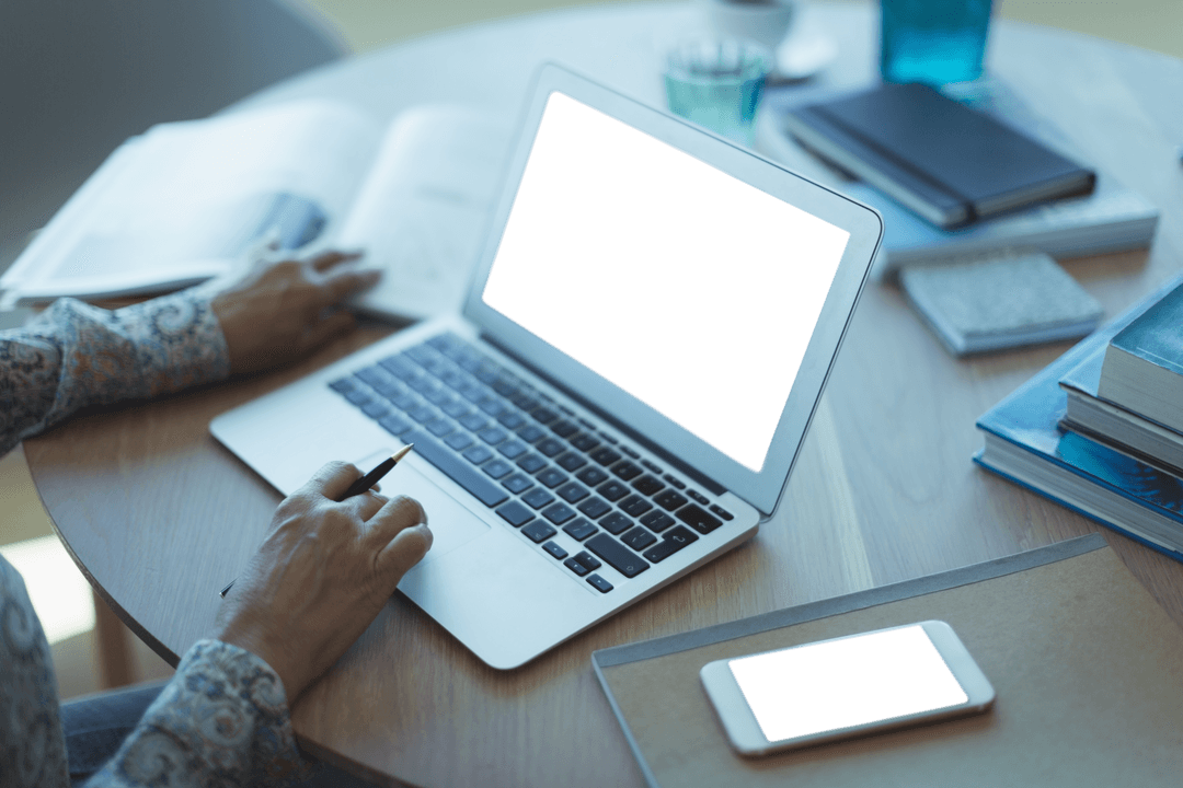 Businesswoman Working on Laptop with Transparent Screens in Office