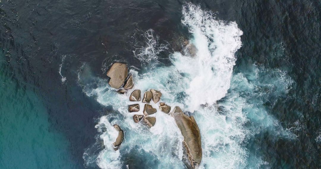 Drone view of clear green ocean water and rocks with copy space - Free Images, Stock Photos and Pictures on Pikwizard.com