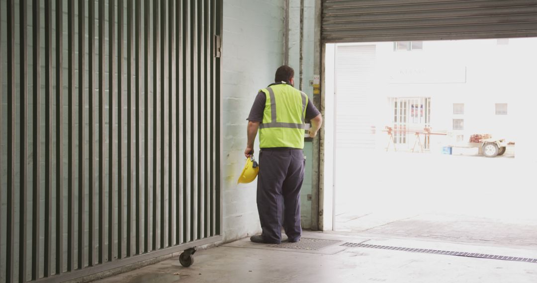 Warehouse Worker Takes Break in Loading Area - Free Images, Stock Photos and Pictures on Pikwizard.com