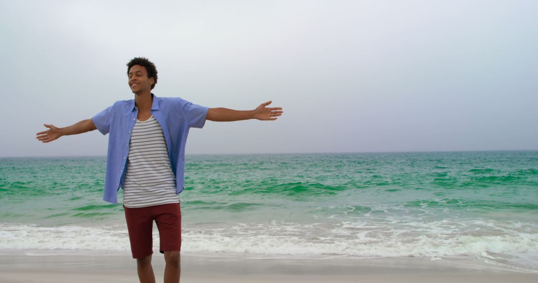 Relaxed Man Embracing the Beach View with Open Arms