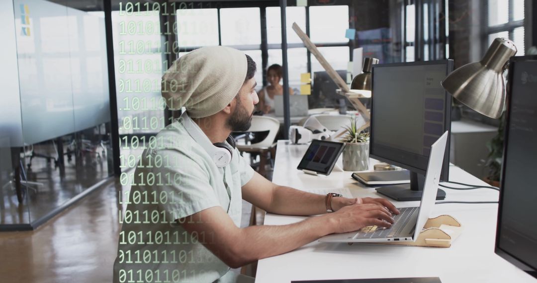 Young Professional Biracial Businessman Coding in Modern Office