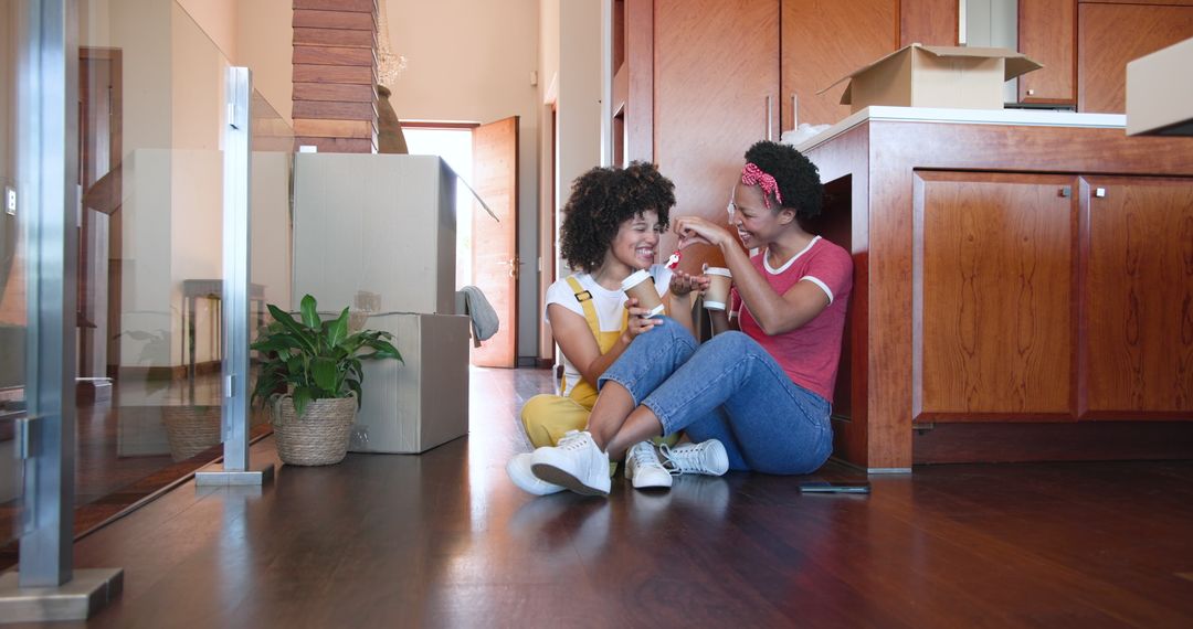 Couple Sharing Coffee While Unpacking in New Home