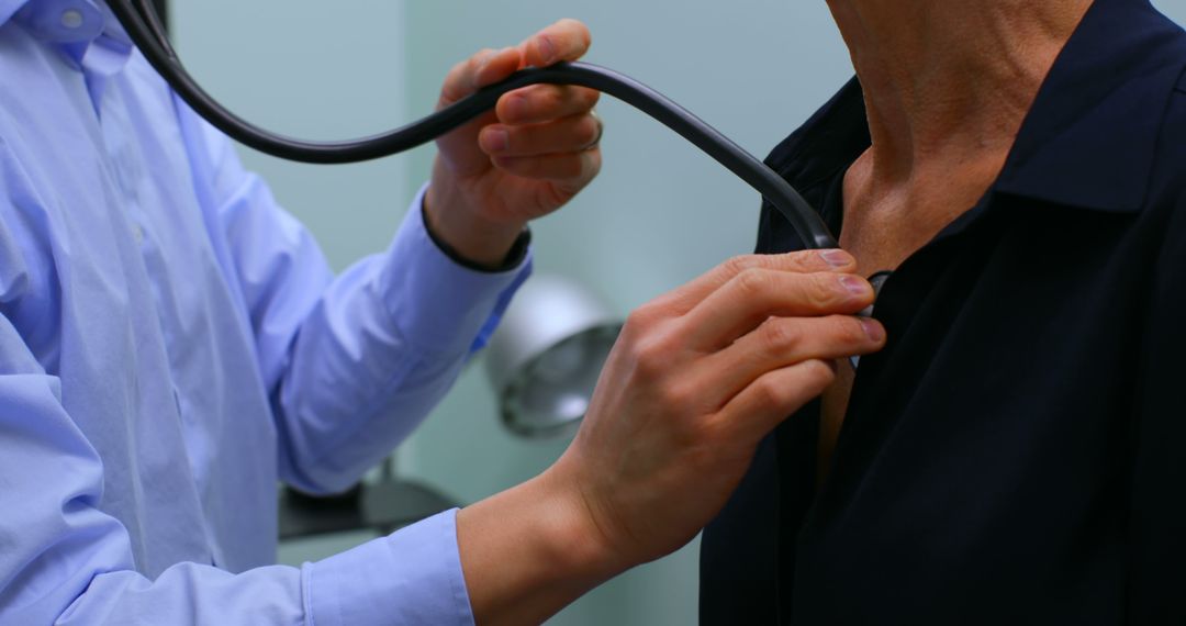 Doctor Using Stethoscope on Patient for Medical Examination - Free Images, Stock Photos and Pictures on Pikwizard.com