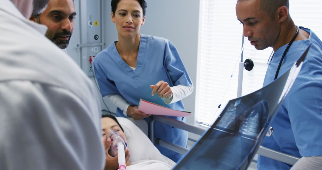 Medical Team Examining X-ray of Patient in Hospital - Free Images, Stock Photos and Pictures on Pikwizard.com