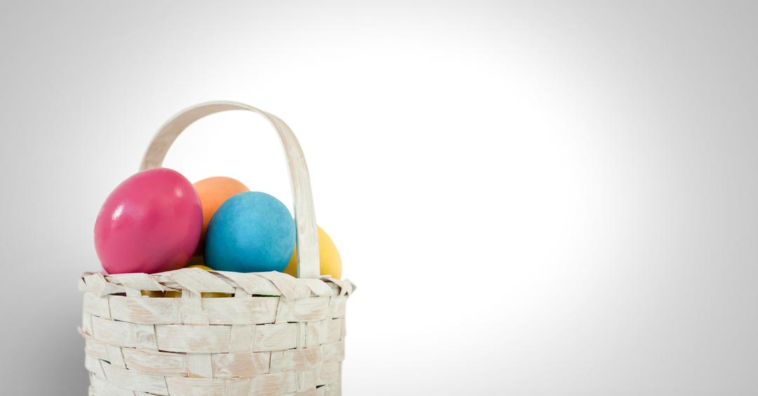 Colorful Easter Eggs in Woven White Basket on Grey Background - Free Images, Stock Photos and Pictures on Pikwizard.com