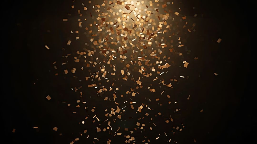 Shimmering Gold Confetti in Dark Ambient Light