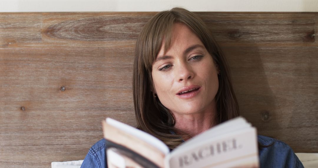 Middle Aged Woman Enjoying Leisure Time with a Book at Home in Slow Motion