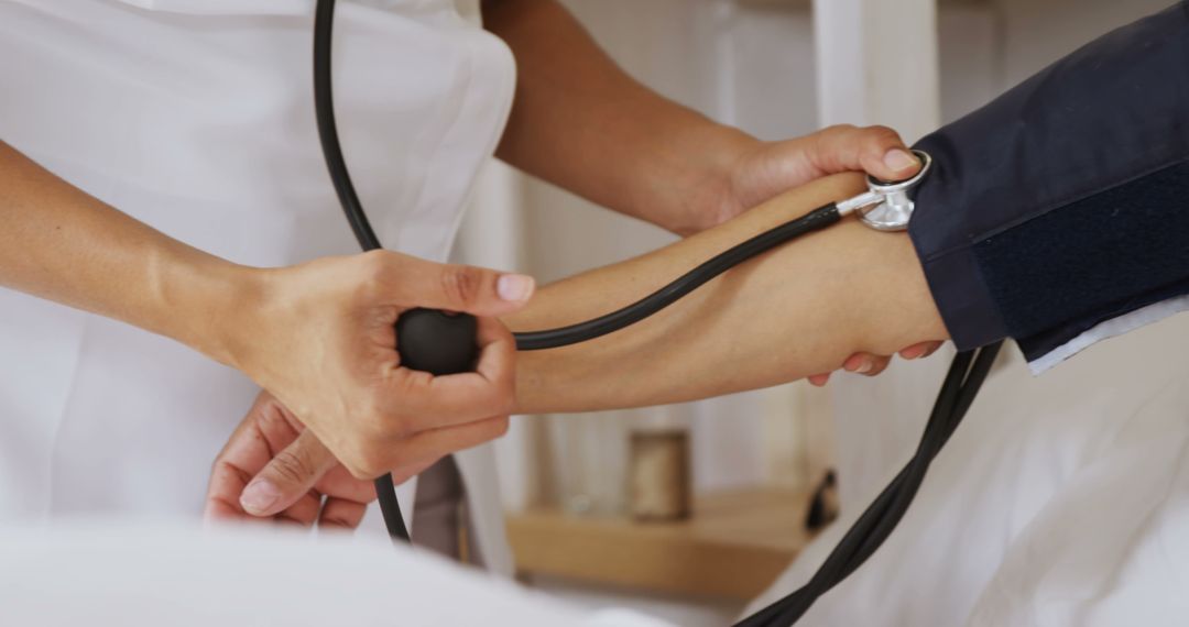 Medical professional measuring patient's blood pressure - Free Images, Stock Photos and Pictures on Pikwizard.com